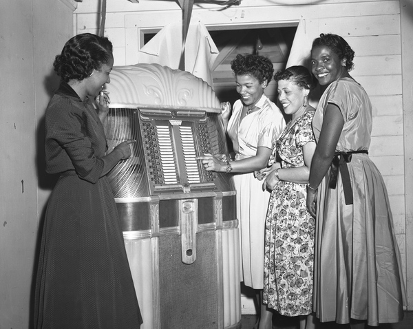 Women at the jukebox during a New Year’s Eve part in Tallahassee, Florida